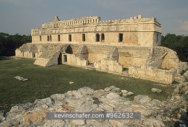 MEXICO, YUCATAN: Mayan ruins of Kabah, sitting on green hillside.