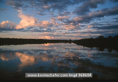 PAPUA NEW GUINEA: Sunset over rainforest and Sepik River, Papua New Guinea.