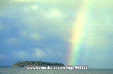 PAPUA NEW GUINEA: Papua New Guinea, Solomon Sea, Unnamed island, Rainbow after a passing shower.